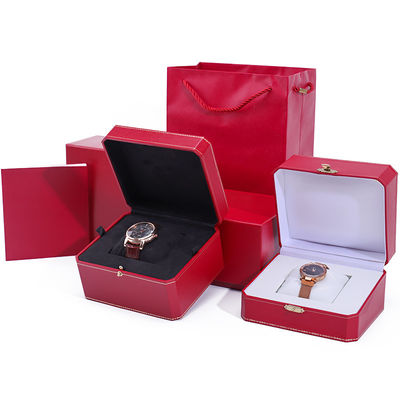 Une boîte de montres en papier dur octogonale avec des boutons en or