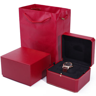 Une boîte de montres en papier dur octogonale avec des boutons en or