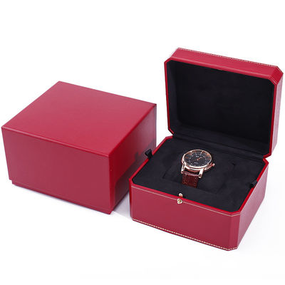 Une boîte de montres en papier dur octogonale avec des boutons en or