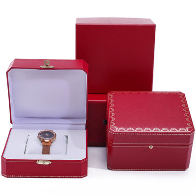 Une boîte de montres en papier dur octogonale avec des boutons en or
