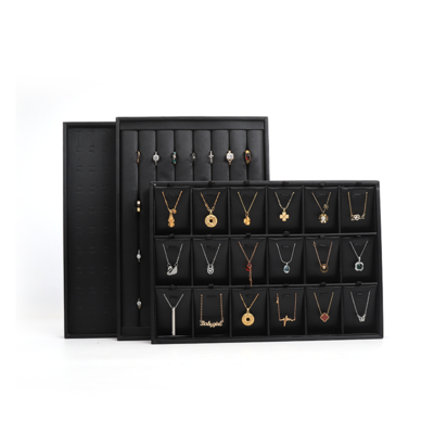 Plateaux à bijoux en cuir noir de luxe personnalisables OEM, présentoirs pour bagues, bracelets et colliers